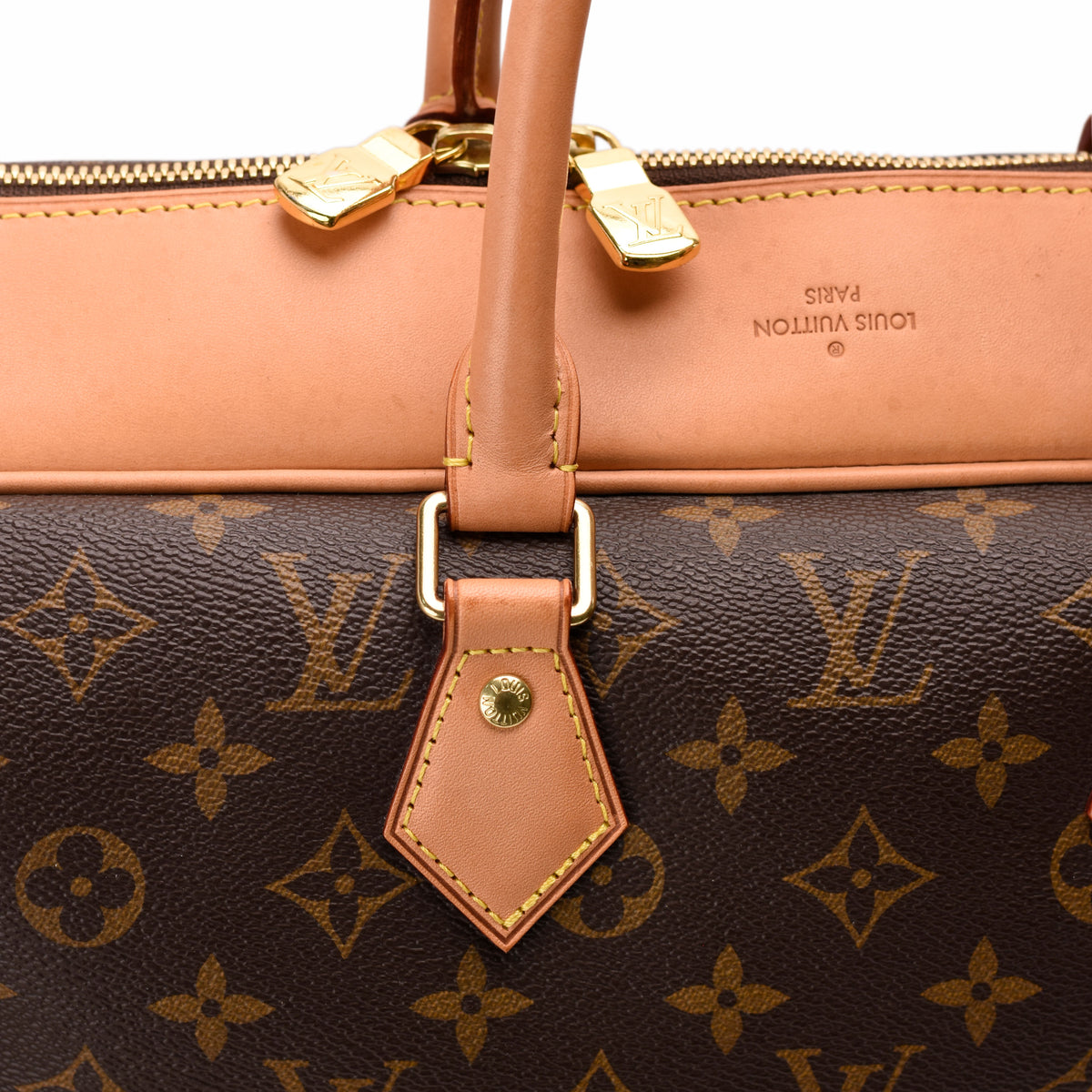 Close-up of a brown Louis Vuitton monogram canvas handbag with tan leather handles, curated Pre-loved Luxury by Myluxe in Helsinki.