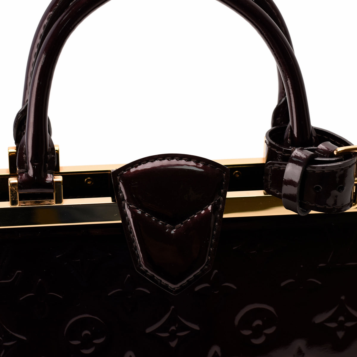 Dark burgundy patent leather monogram handbag with gold-tone hardware, curated Pre-loved Luxury by Myluxe in Helsinki.