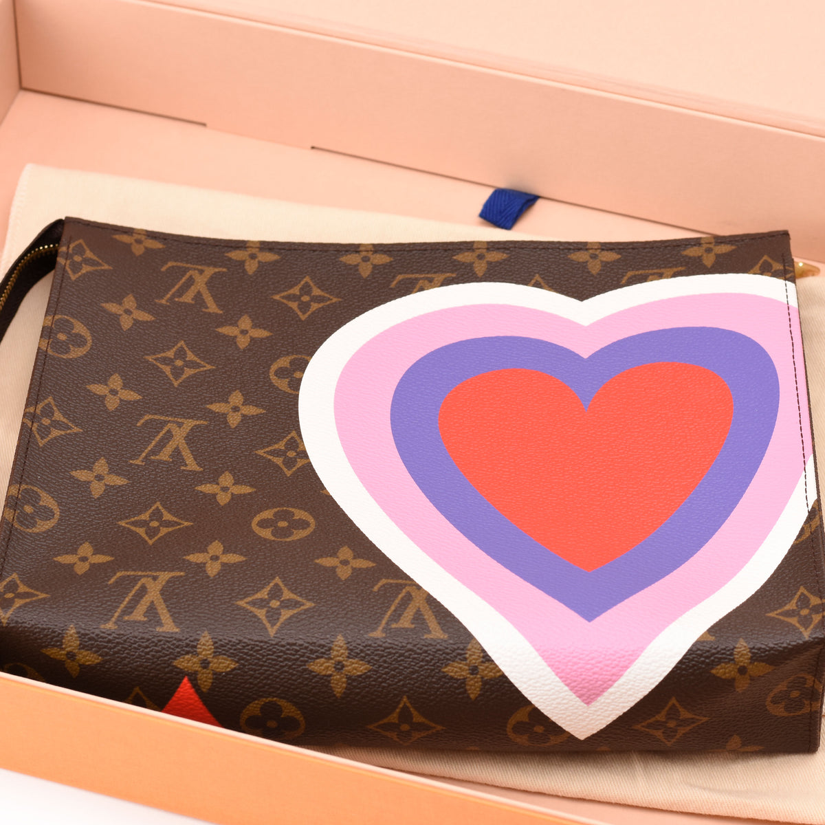 Louis Vuitton monogram canvas clutch with large colorful heart graphic. curated Pre-loved Luxury by Myluxe in Helsinki.