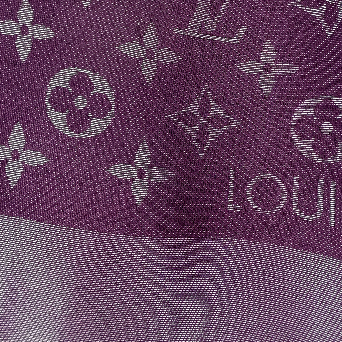 Purple Louis Vuitton monogram pattern fabric detail. curated Pre-loved Luxury by Myluxe in Helsinki.