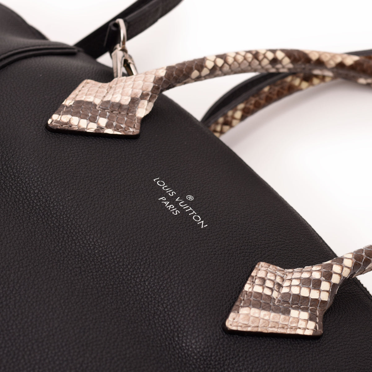Louis Vuitton black grained leather handbag with brown snakeskin texture handles. curated Pre-loved Luxury by Myluxe in Helsinki.