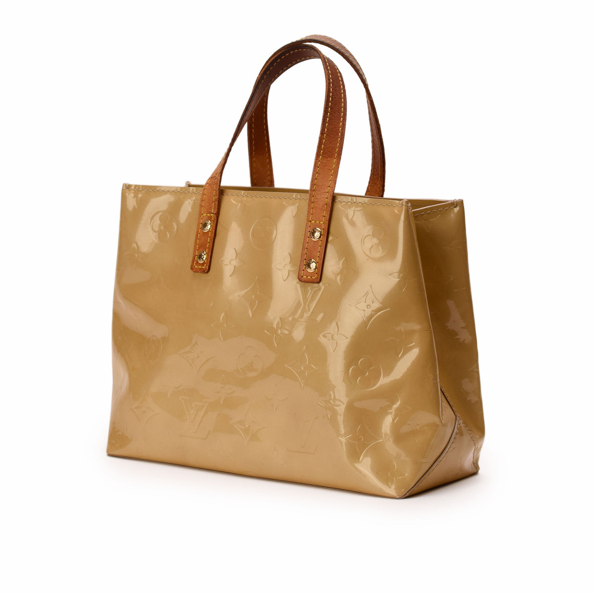 Louis Vuitton beige patent leather monogram tote bag with brown leather handles. curated Pre-loved Luxury by Myluxe in Helsinki.