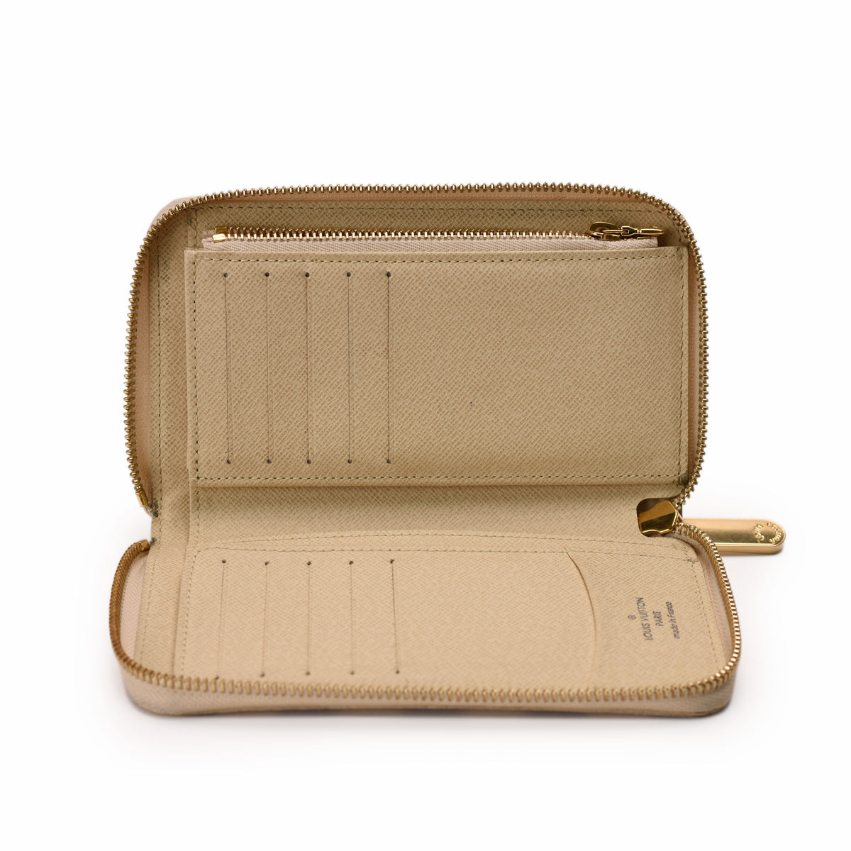 Open beige Louis Vuitton monogram coated canvas zip-around wallet, curated Pre-loved Luxury by Myluxe in Helsinki.
