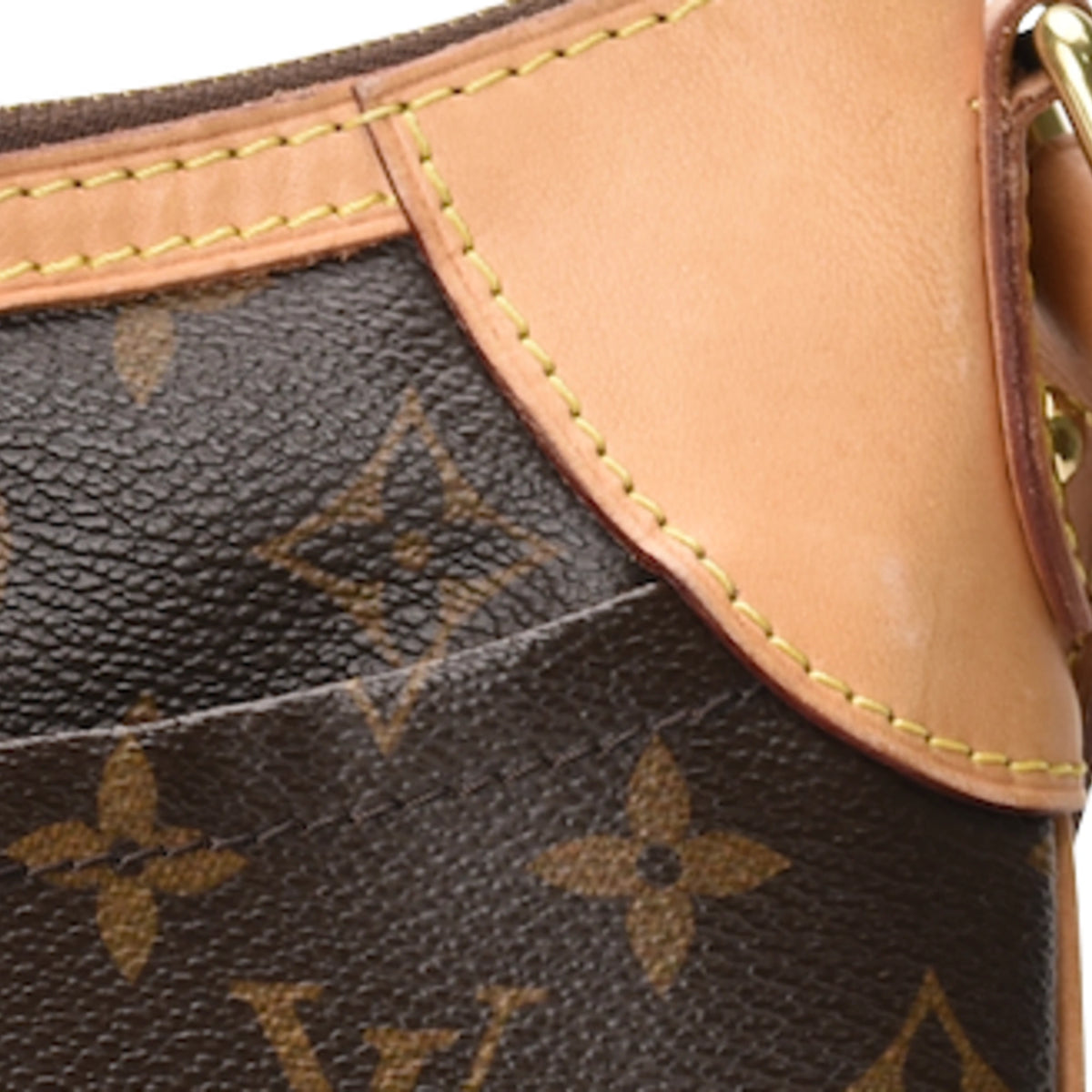 Close-up of Louis Vuitton Odeon PM brown Monogram canvas with tan leather trim. curated Pre-loved Luxury by Myluxe in Helsinki.