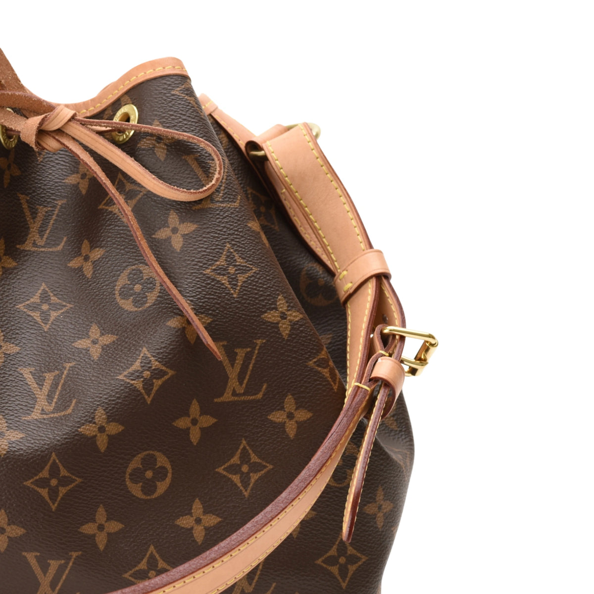 Louis Vuitton Monogram canvas bucket bag with tan leather trim. curated Pre-loved Luxury by Myluxe in Helsinki.