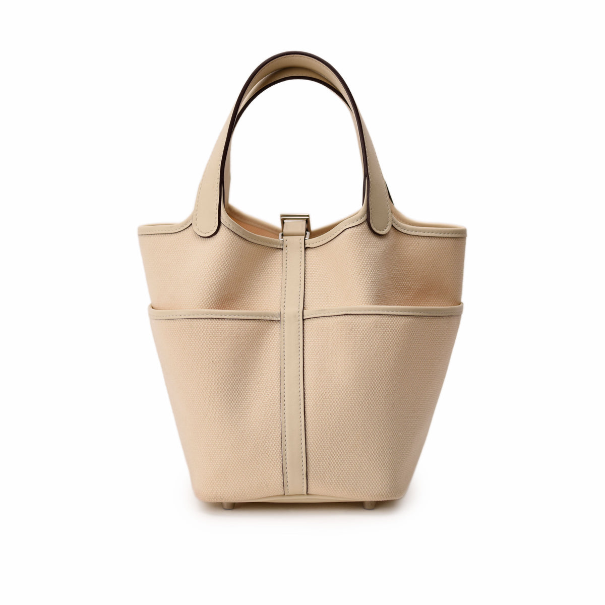 Beige canvas tote bag with cream leather trim and dual handles. curated Pre-loved Luxury by Myluxe in Helsinki.
