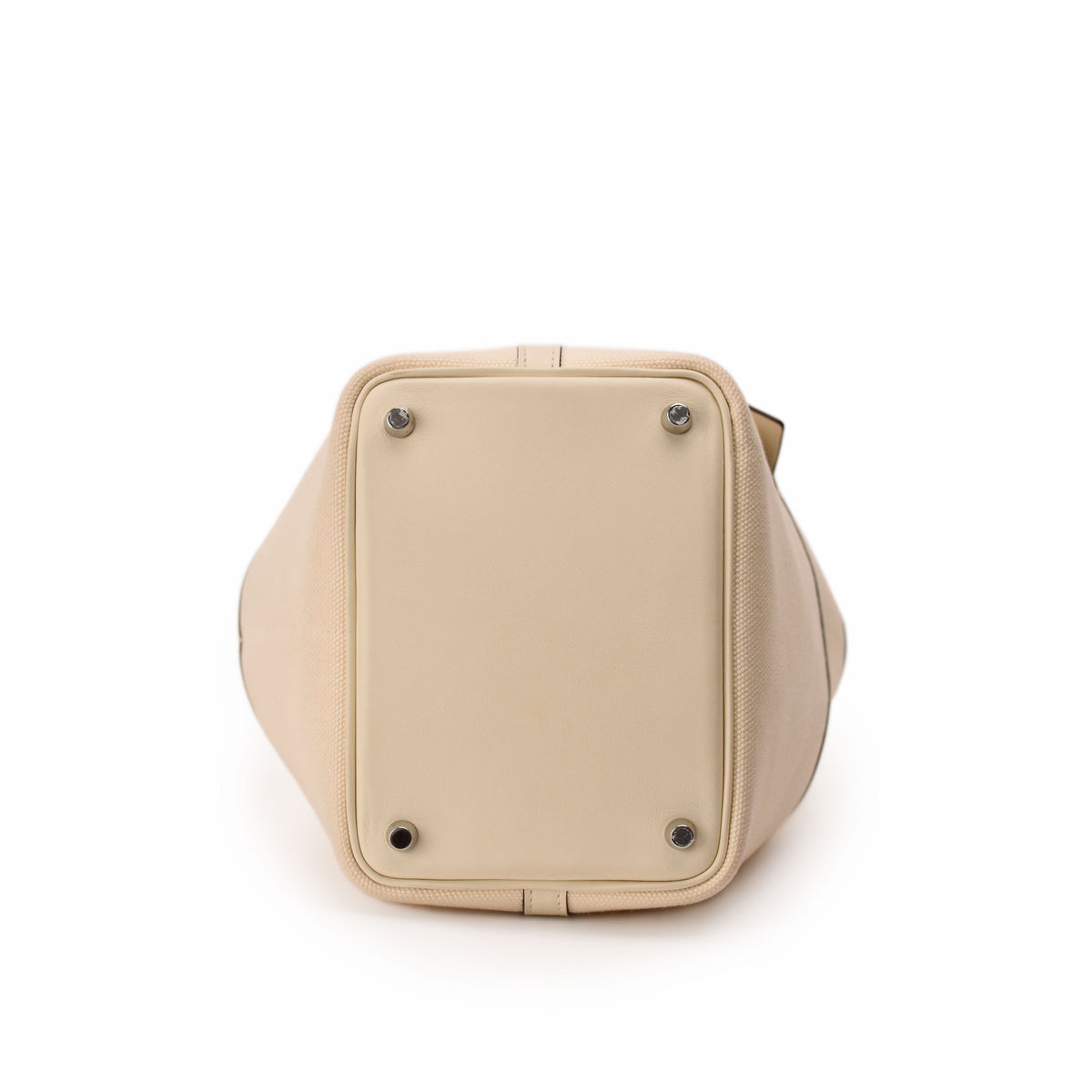 Beige leather luxury handbag base with protective metal studs. curated Pre-loved Luxury by Myluxe in Helsinki.