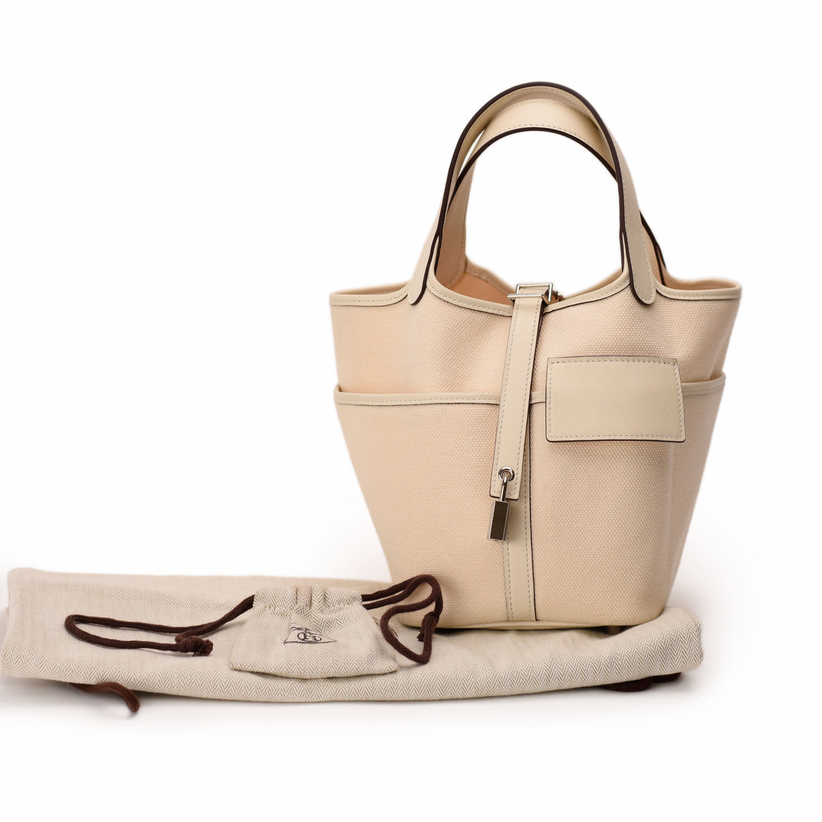 Cream beige canvas tote bag with leather trim and drawstring detail. curated Pre-loved Luxury by Myluxe in Helsinki.