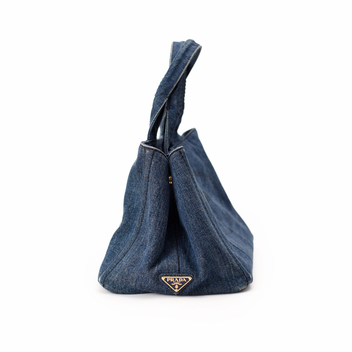 Prada blue denim tote bag with top handles. curated Pre-loved Luxury by Myluxe in Helsinki.