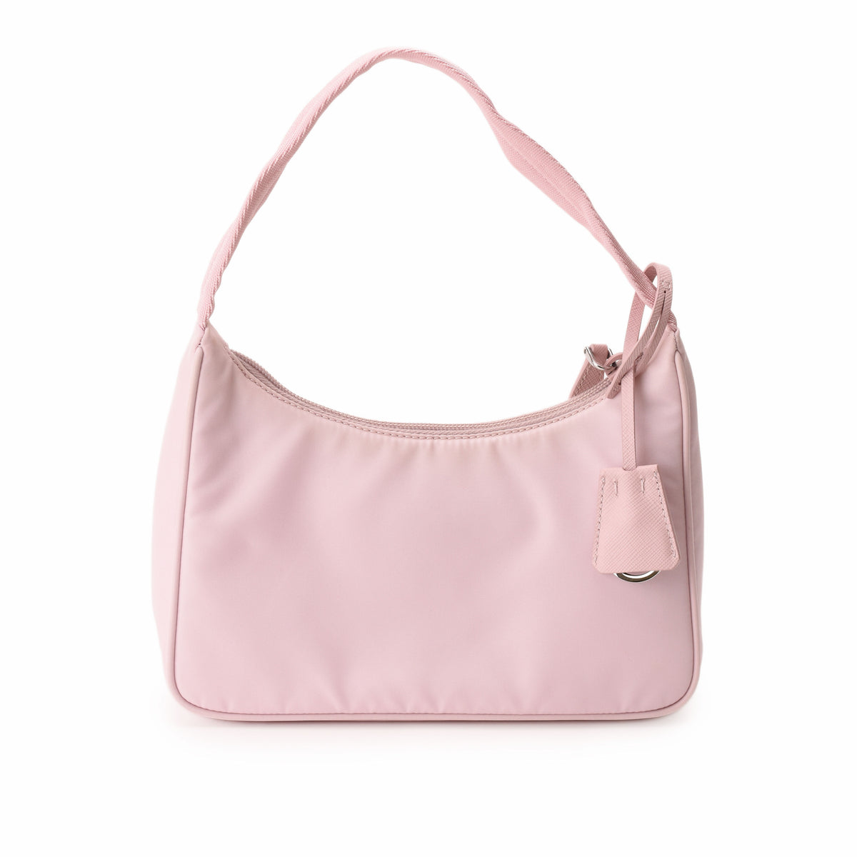 Light pink nylon shoulder bag with a slim strap and decorative hanging charm. curated Pre-loved Luxury by Myluxe in Helsinki.