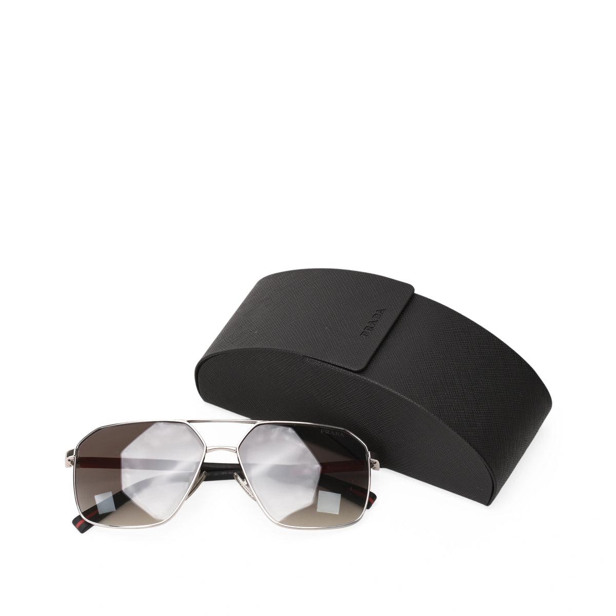 Prada Linea Rossa silver-frame sunglasses with a black case, curated Pre-loved Luxury by Myluxe in Helsinki.