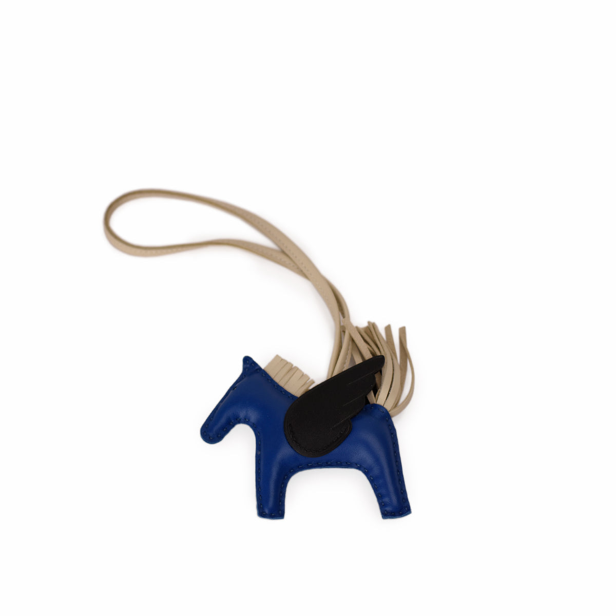Blue leather horse charm with black wing detail. curated Pre-loved Luxury by Myluxe in Helsinki.