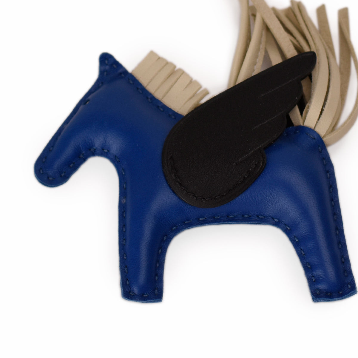 Blue leather winged horse charm with beige fringe. curated Pre-loved Luxury by Myluxe in Helsinki.