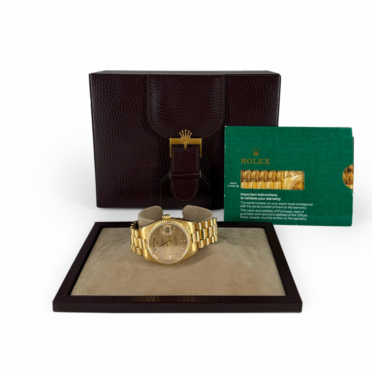 Gold Rolex watch with champagne dial in a leather presentation box, curated Pre-loved Luxury by Myluxe in Helsinki.