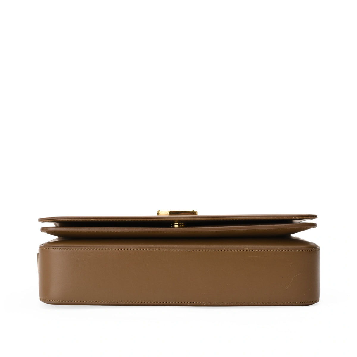 Brown leather Hermès clutch with gold hardware, curated Pre-loved Luxury by Myluxe in Helsinki.
