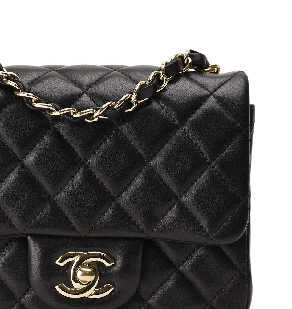 Black quilted leather Chanel handbag with gold-tone chain strap. curated Pre-loved Luxury by Myluxe in Helsinki.