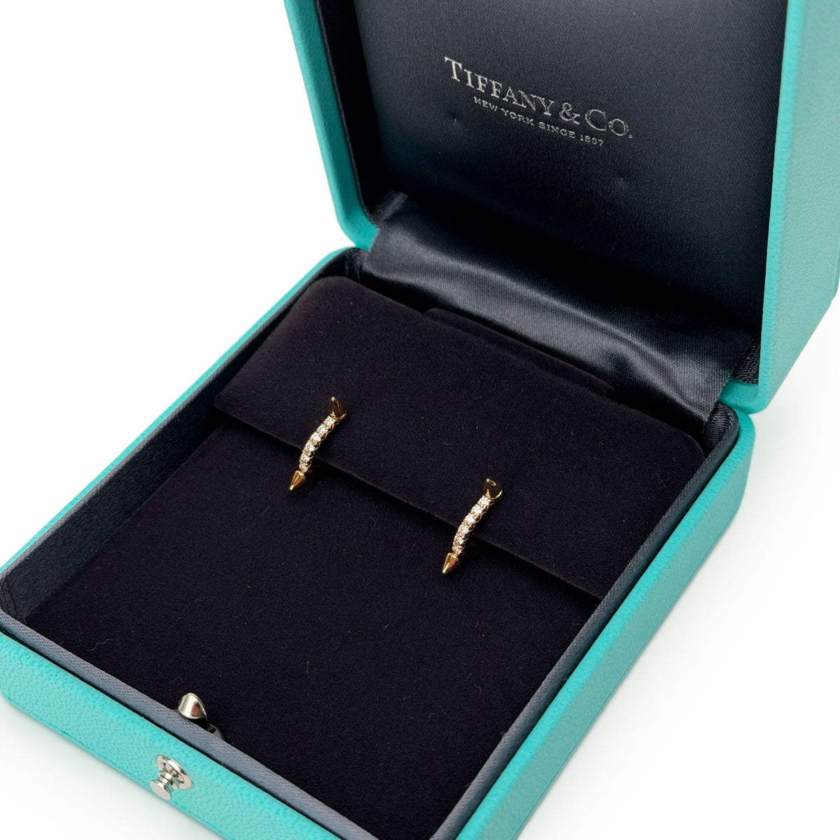 Gold diamond-studded hoop earrings in a Tiffany & Co. blue box, curated Pre-loved Luxury by Myluxe in Helsinki.