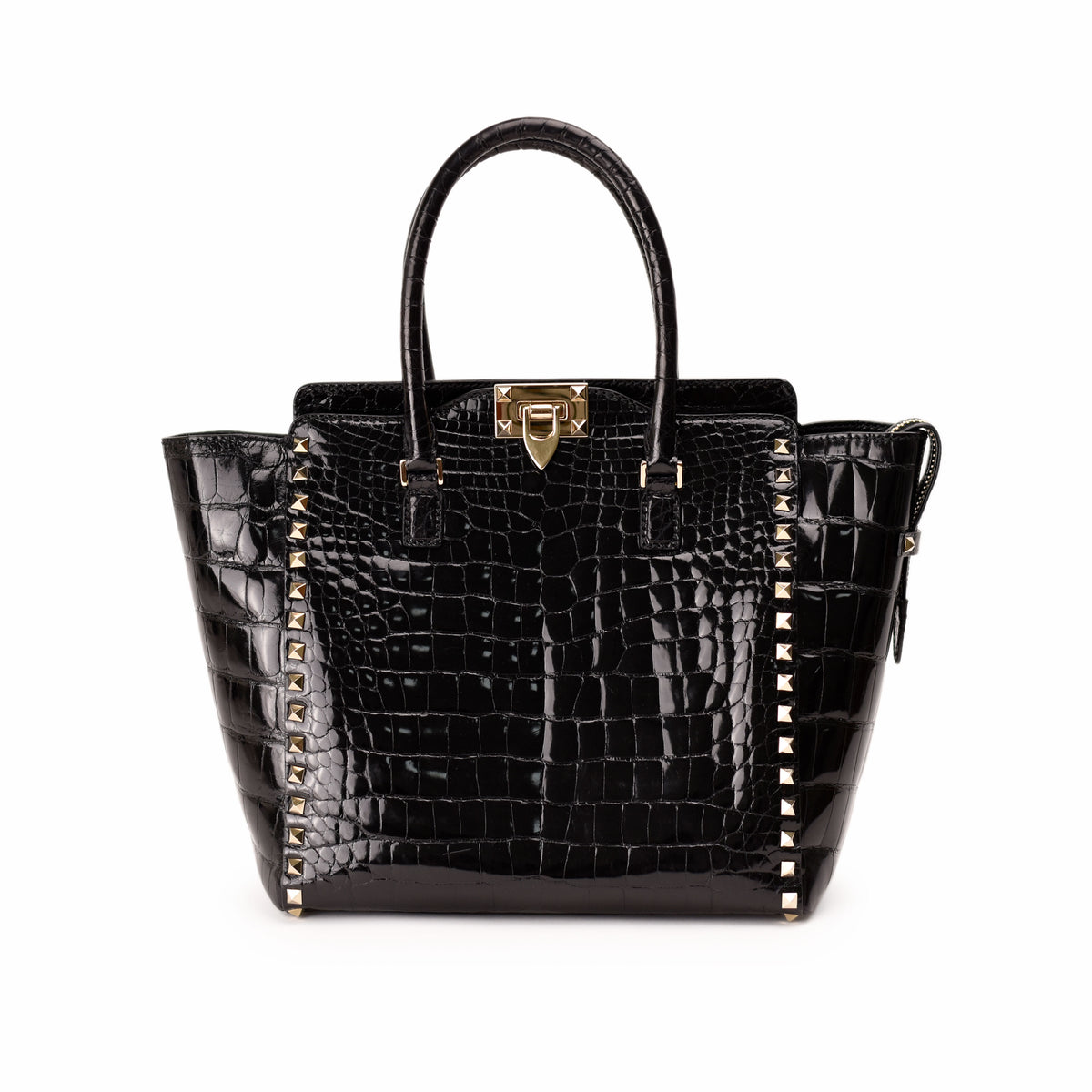 Black crocodile embossed leather handbag with gold studs, curated Pre-loved Luxury by Myluxe in Helsinki.
