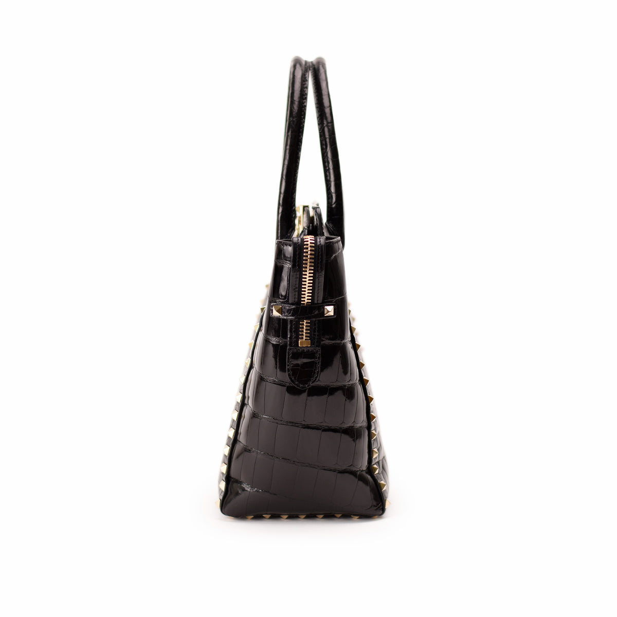 Black crocodile-embossed leather handbag with gold studs and zipper, curated Pre-loved Luxury by Myluxe in Helsinki.