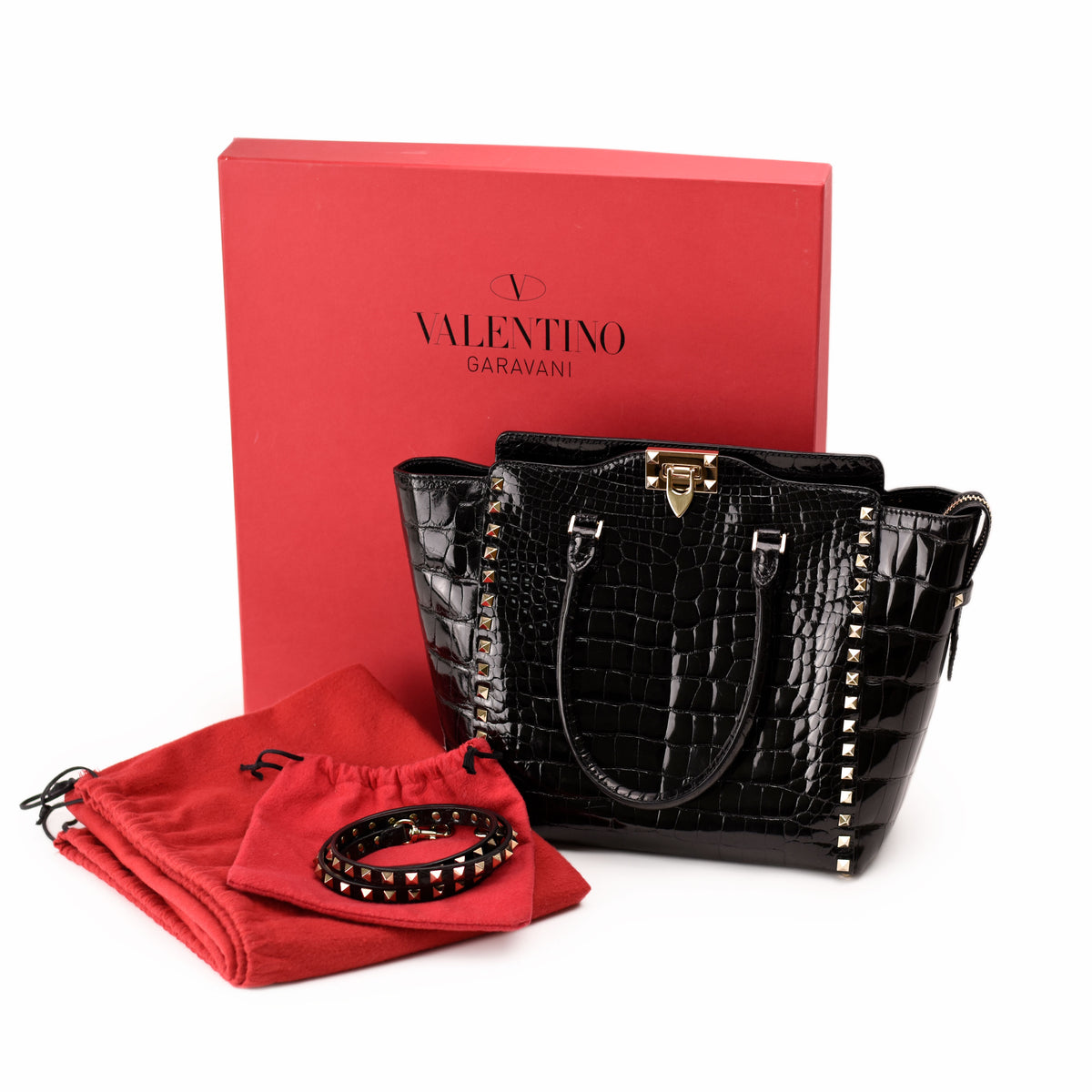Black croc-effect Valentino Garavani handbag with gold studs and red box. curated Pre-loved Luxury by Myluxe in Helsinki.