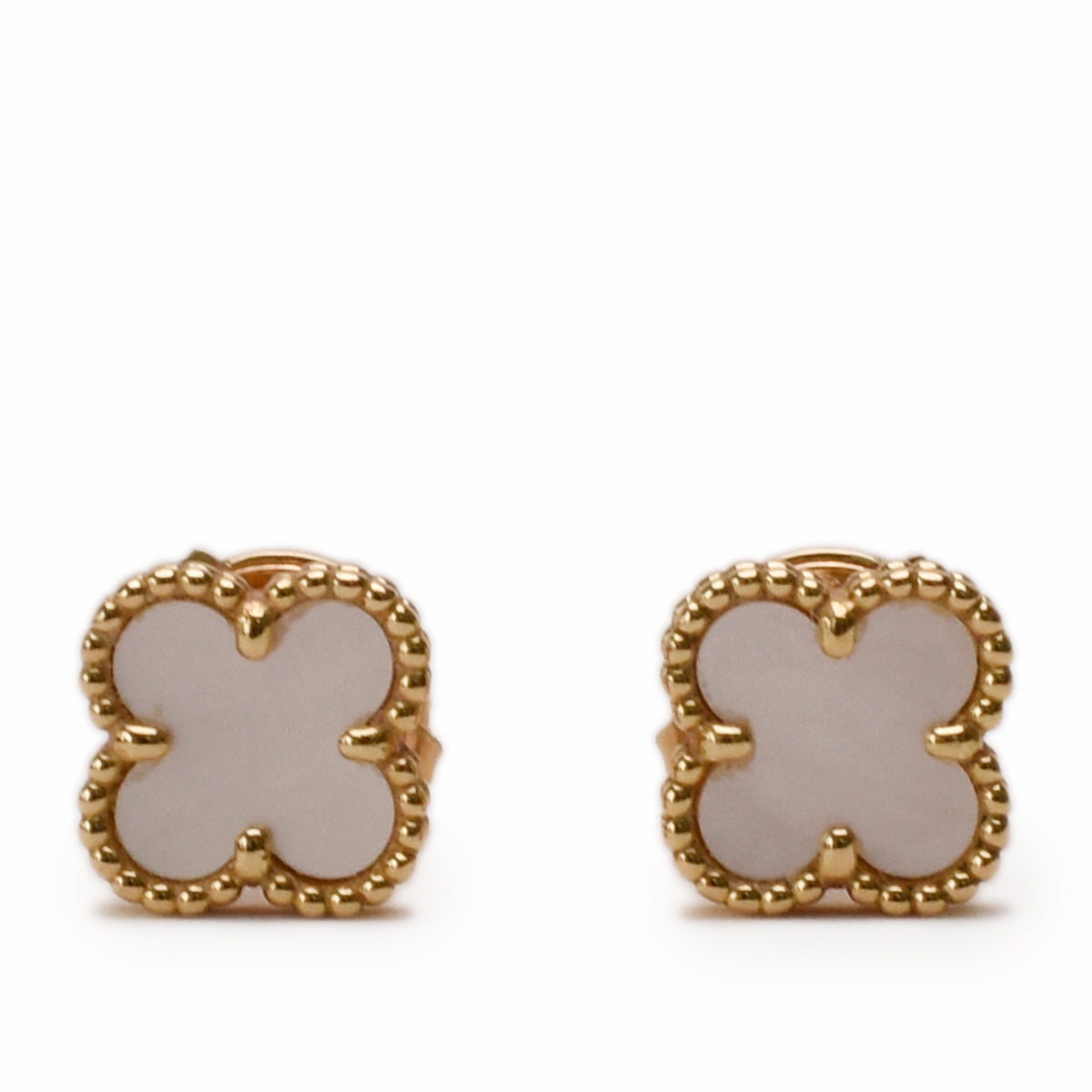 Gold clover-shaped earrings with white mother of pearl inlay, curated Pre-loved Luxury by Myluxe in Helsinki.