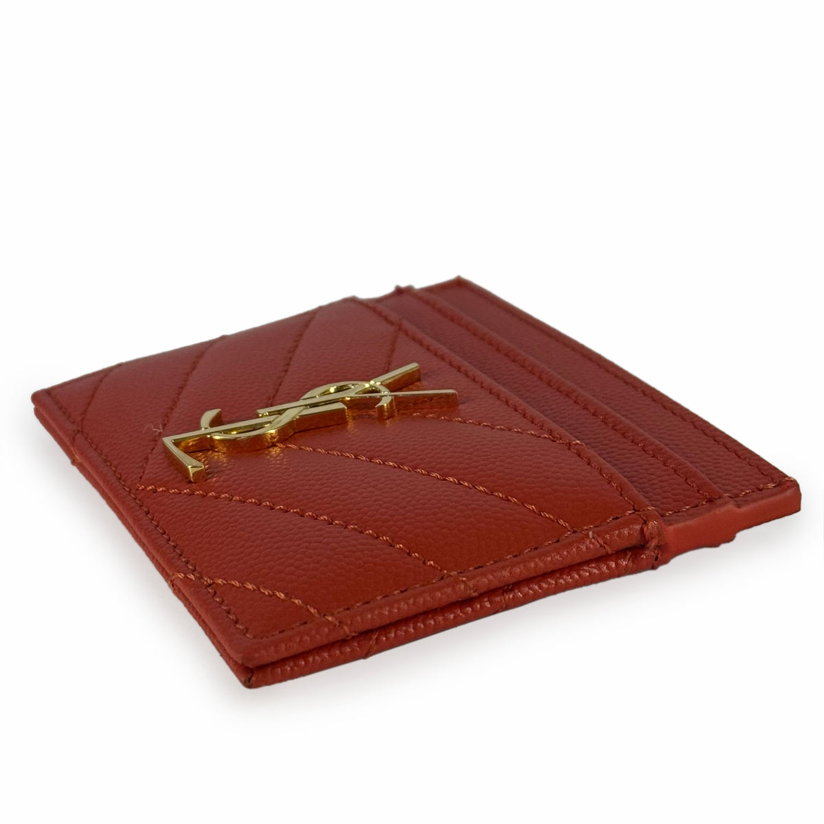 Red quilted leather Saint Laurent card holder with gold YSL logo, curated Pre-loved Luxury by Myluxe in Helsinki.