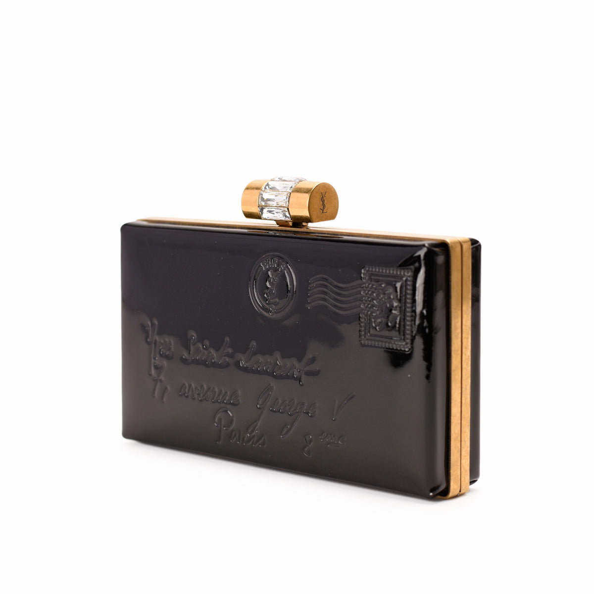 Black patent leather YSL clutch with gold-tone hardware and crystal clasp, curated Pre-loved Luxury by Myluxe in Helsinki.