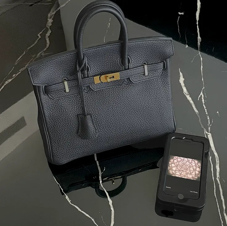 Black Togo leather Birkin handbag with gold-tone hardware, curated Pre-loved Luxury by Myluxe in Helsinki.